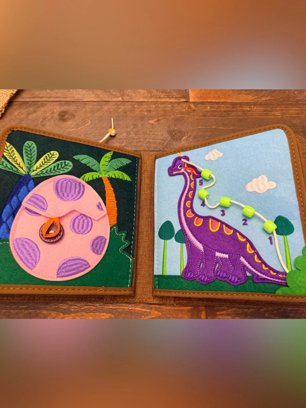 Pinkfong My First Book T-Rex, a Montessori-inspired interactive fabric busy book